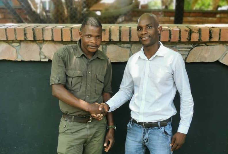 Freedom and Kombani Shaking hands